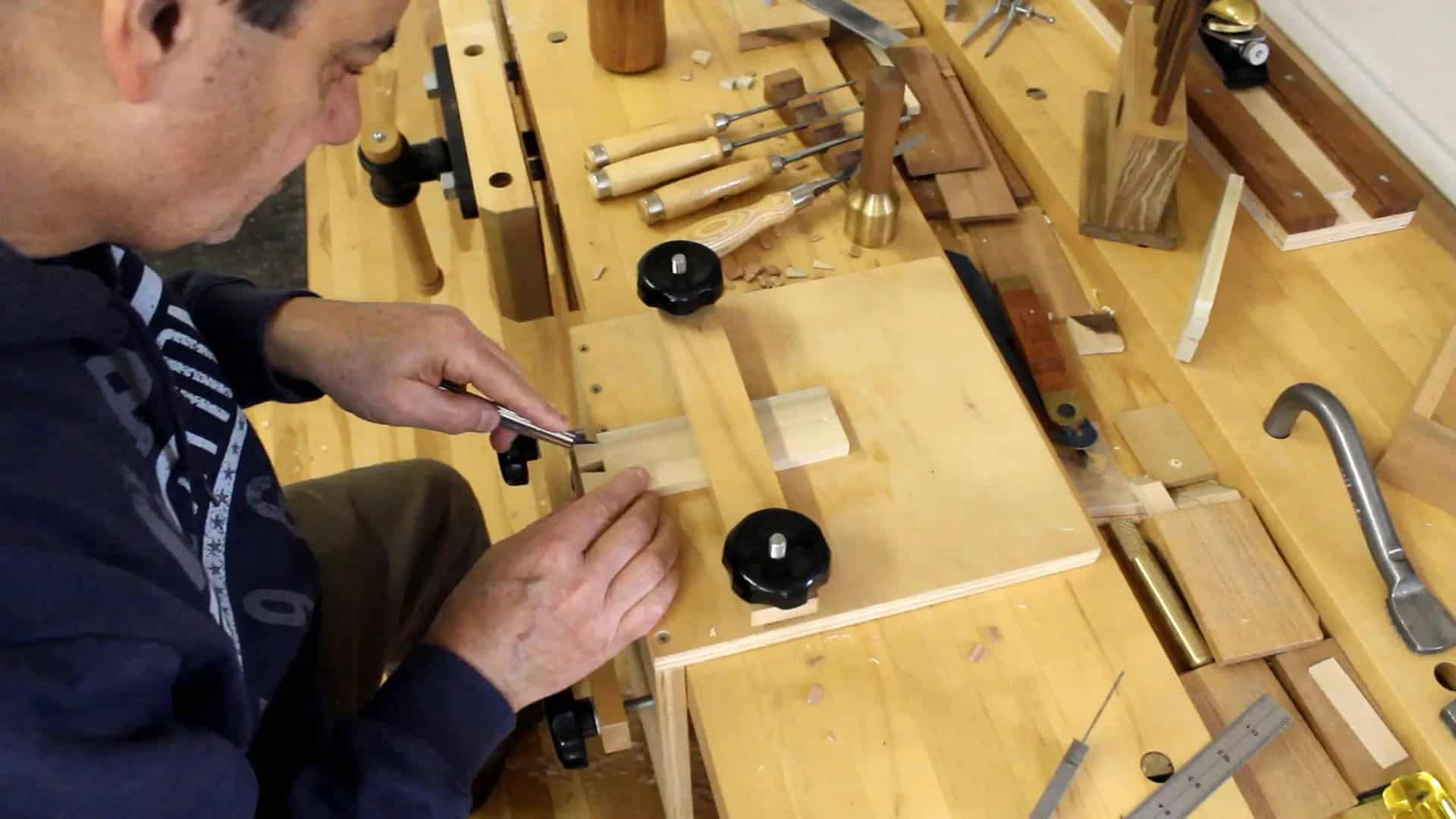 Using a marking knife to outline the tails