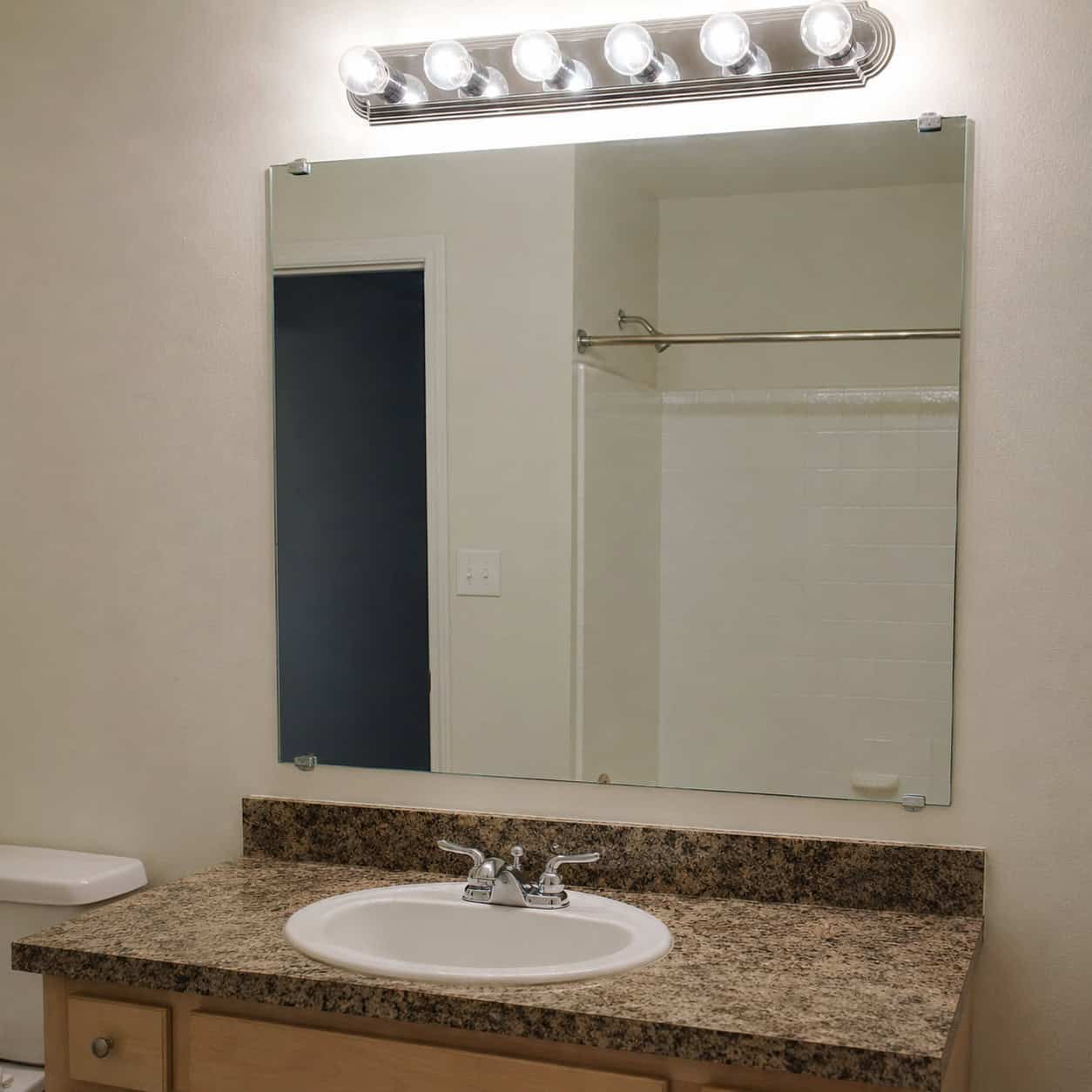 The Frameless Glued-On Bathroom Mirror