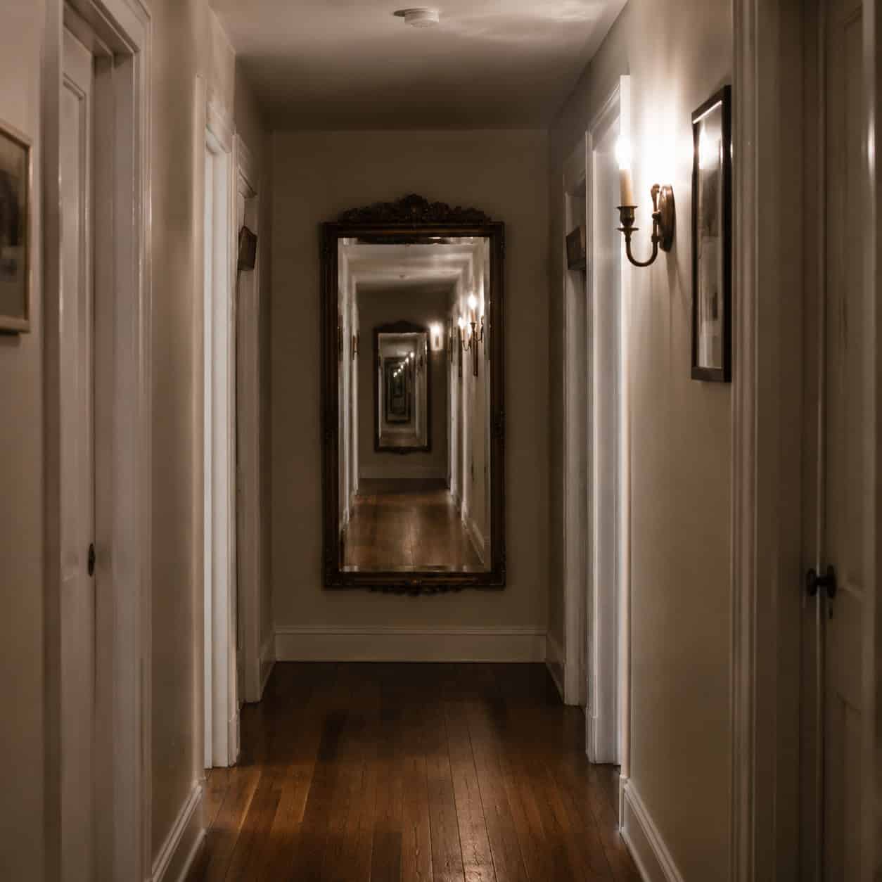 Put a mirror at the end of a hallway or entry