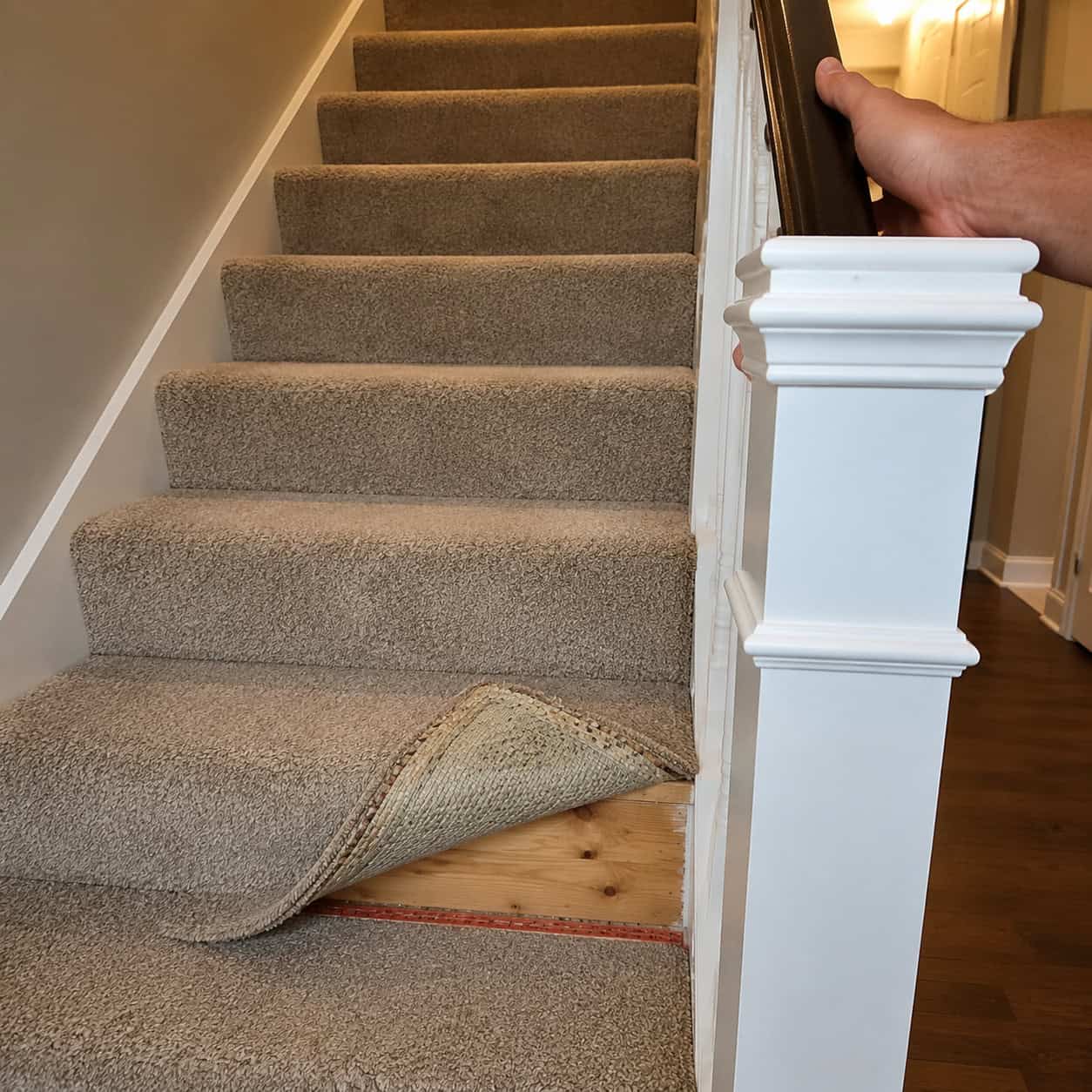 The Wobbly Newel Post and Carpeted Stair Treads
