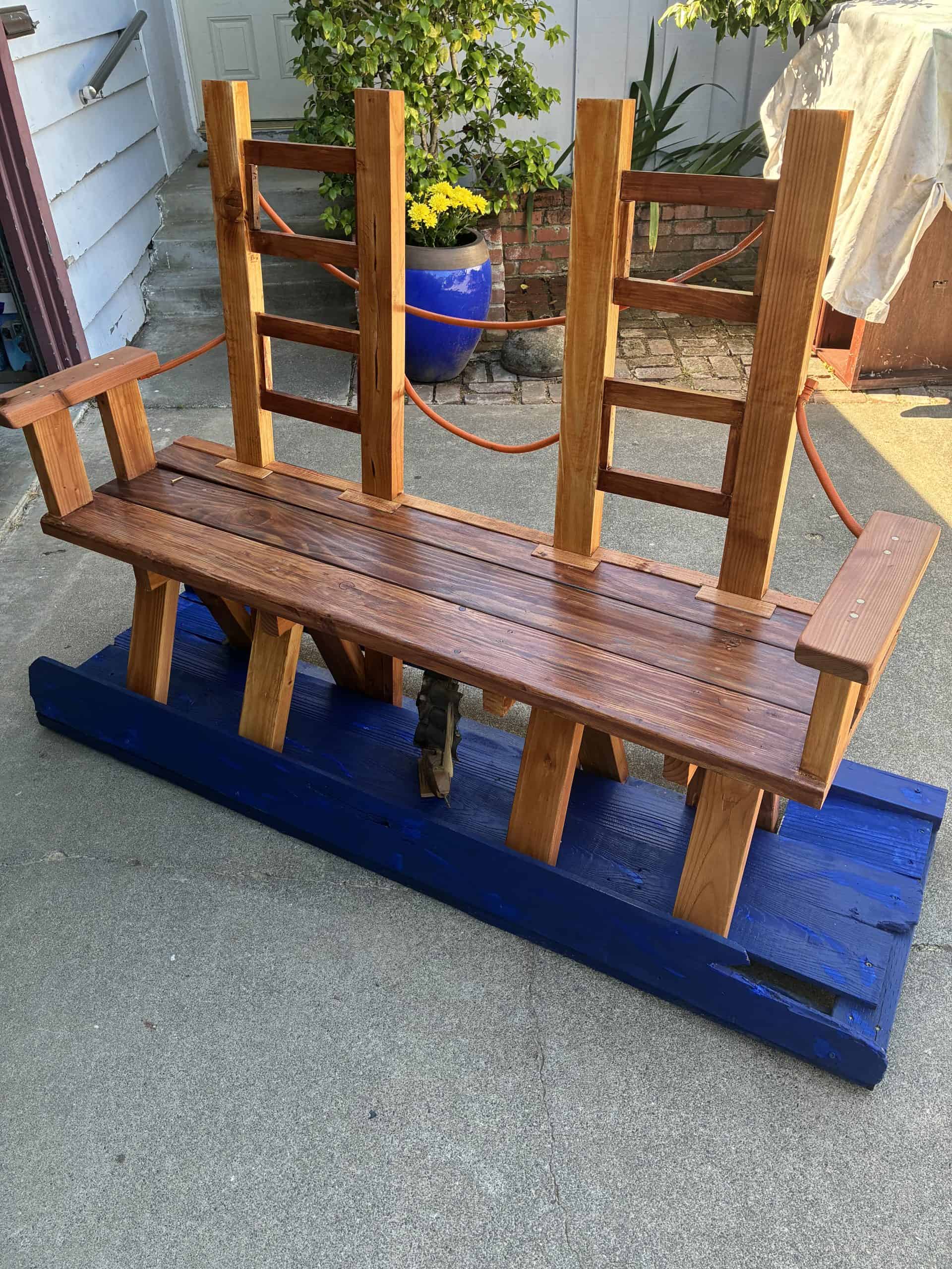 Look under the deck — there’s a ship sailing beneath the span.