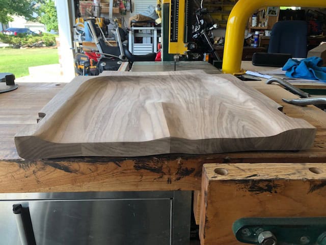 The seat after sculpting — most of this shaping was done with an angle grinder and carving disc.