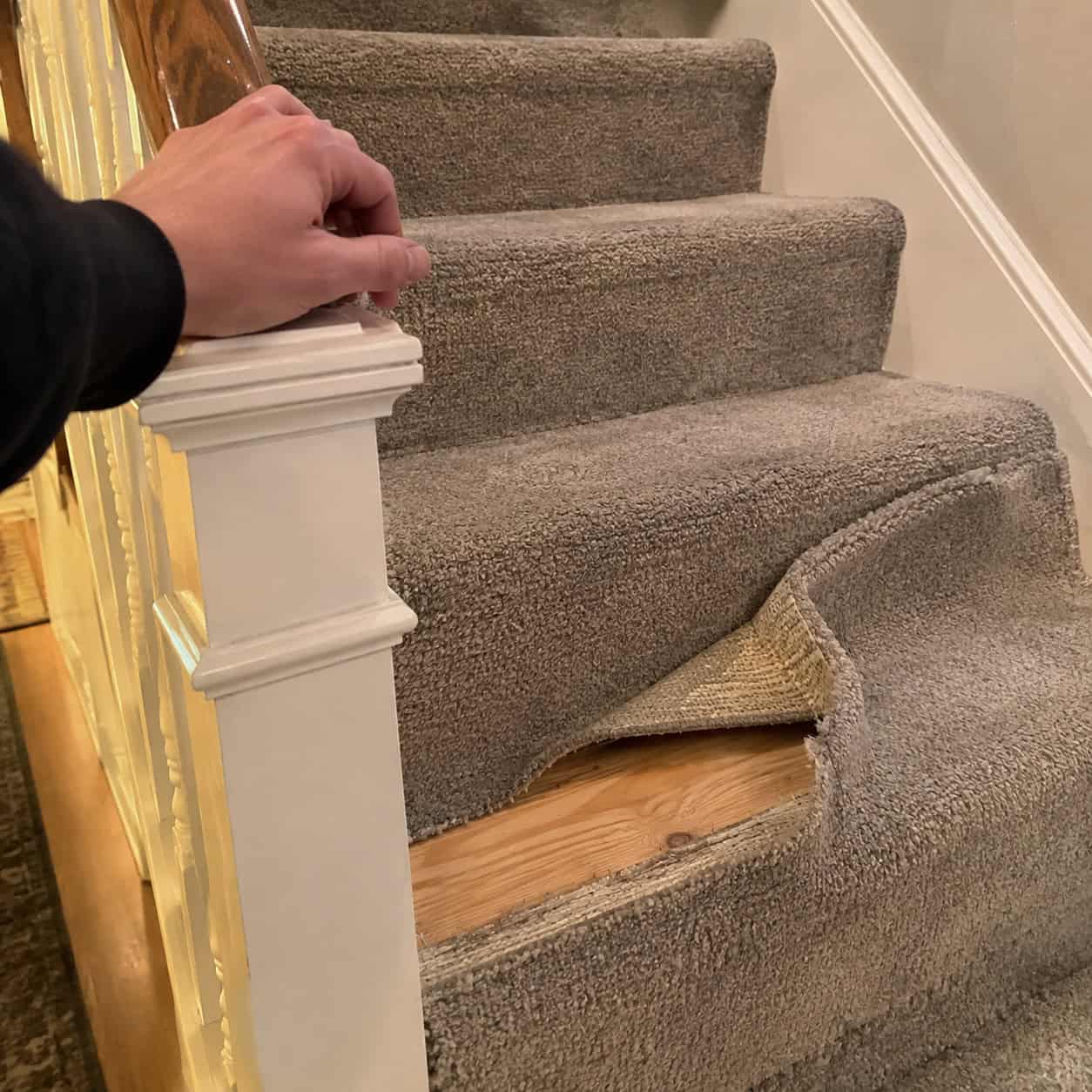 The Wobbly Newel Post and Carpeted Stair Treads