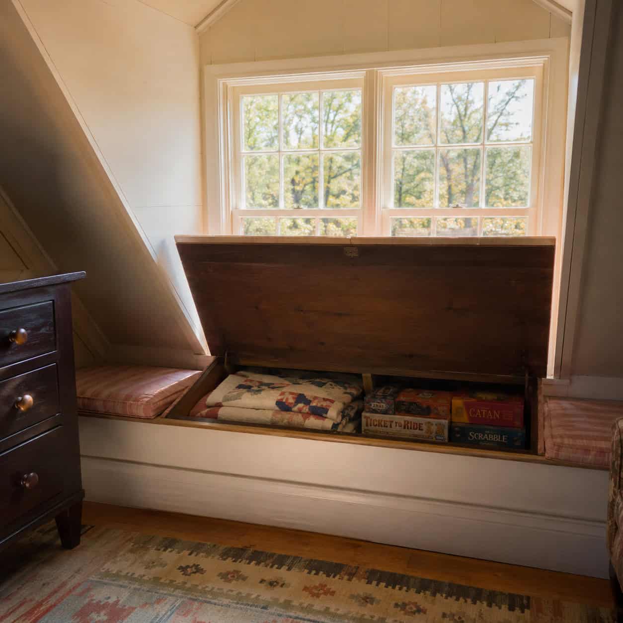 A Window Seat With a Hinged Storage Lid