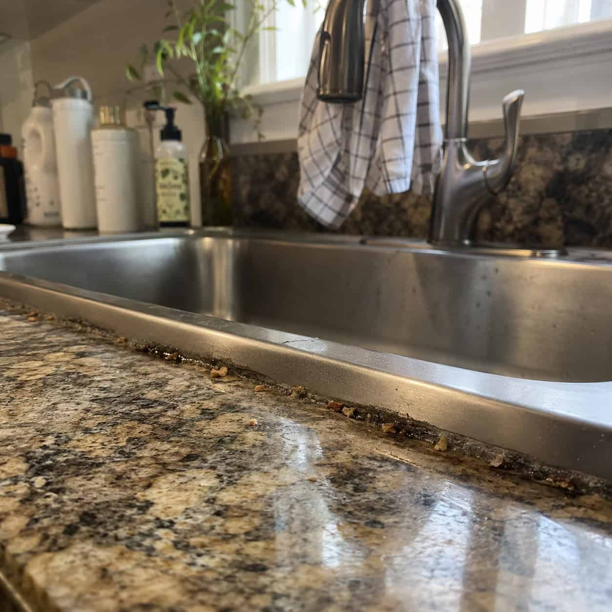 A Drop-In Sink With a Rim Sitting on Stone