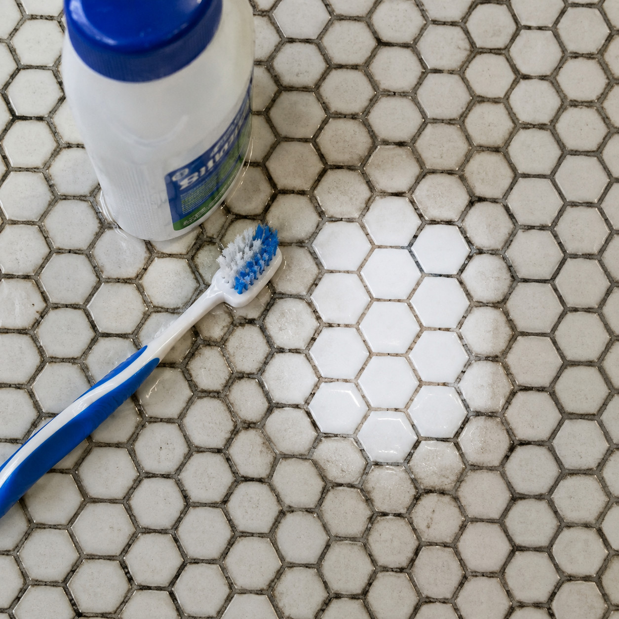 Penny-Round or Tiny Hex Mosaic on a Bathroom Floor