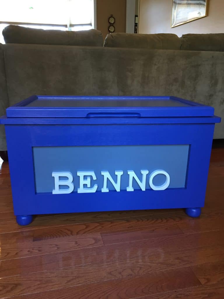The first box in the series, in bright blue with a pale blue panel and "BENNO" lettering, lid closed.