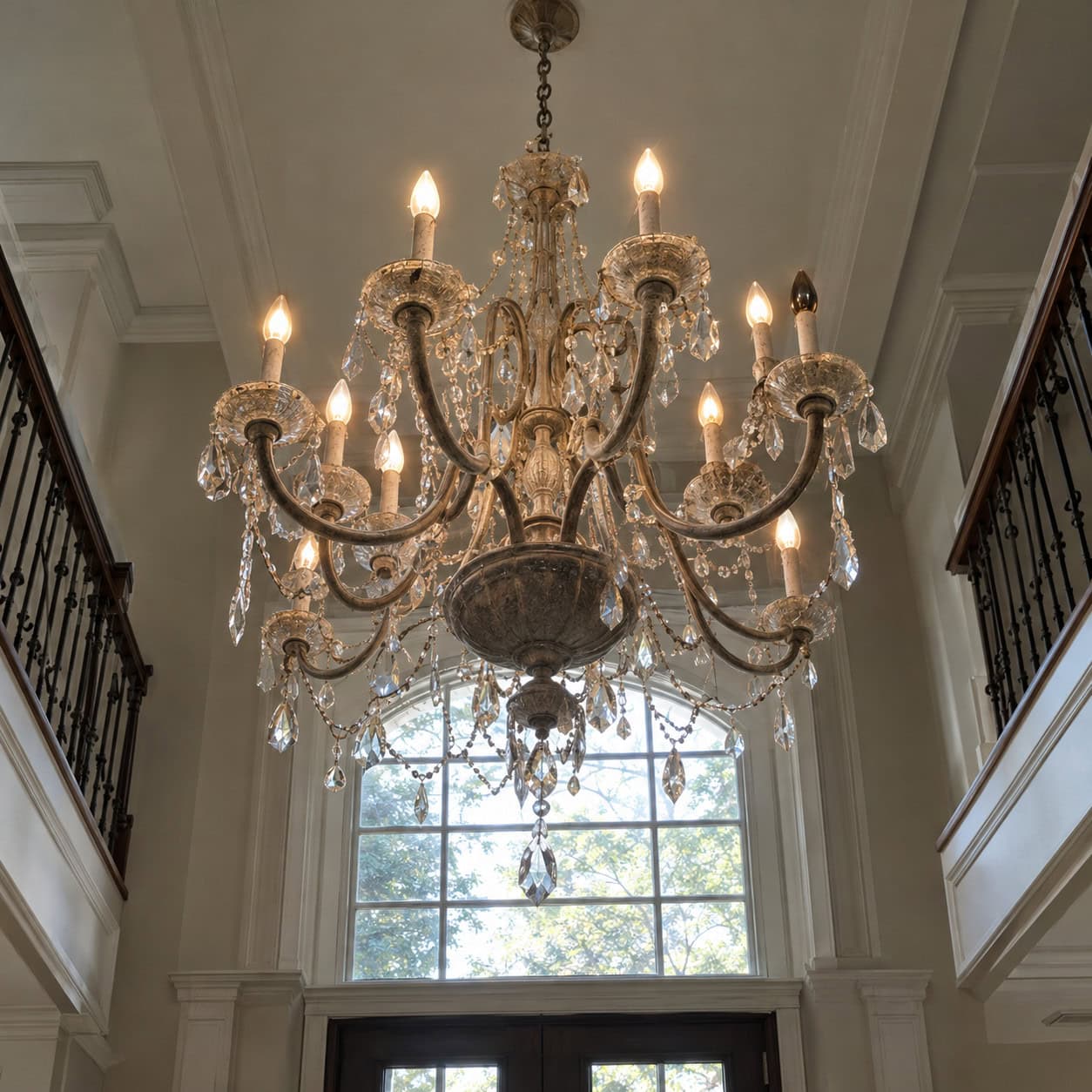 A Chandelier Hung in an Unreachable Two-Story Foyer