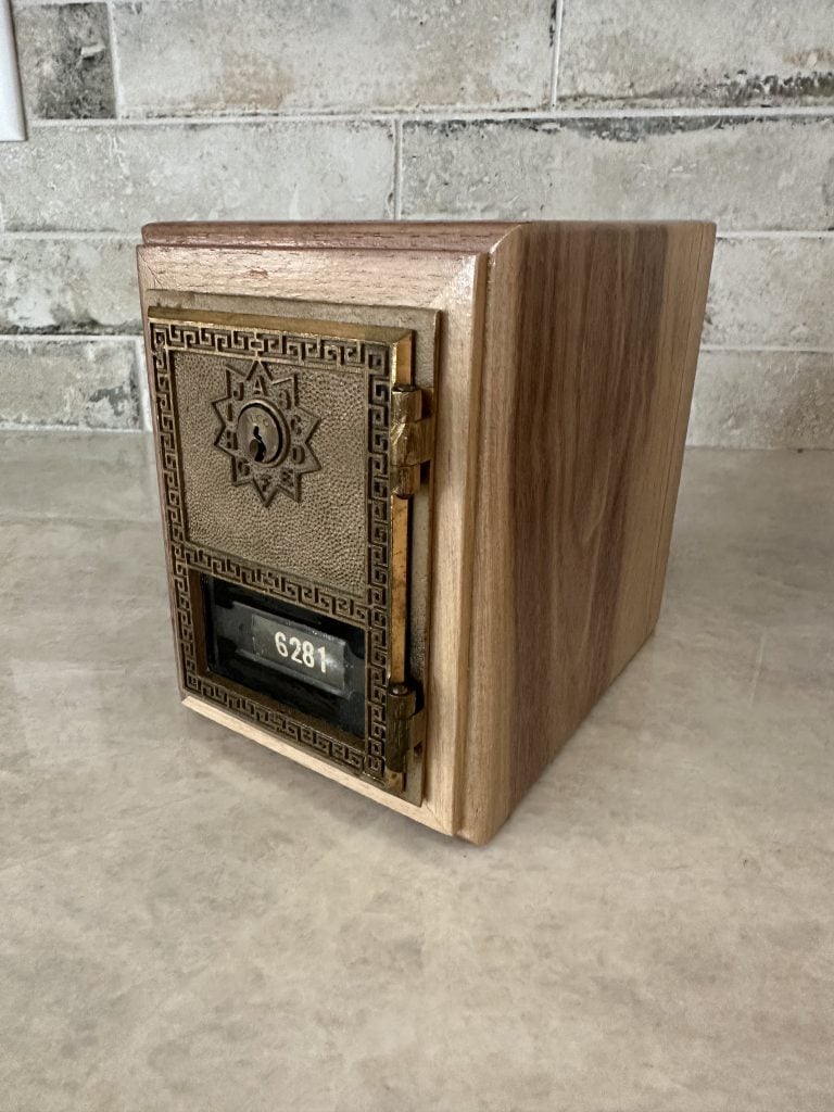 The key-operated door, number 6281, set into its walnut box with the brass hinges on the right-hand edge.