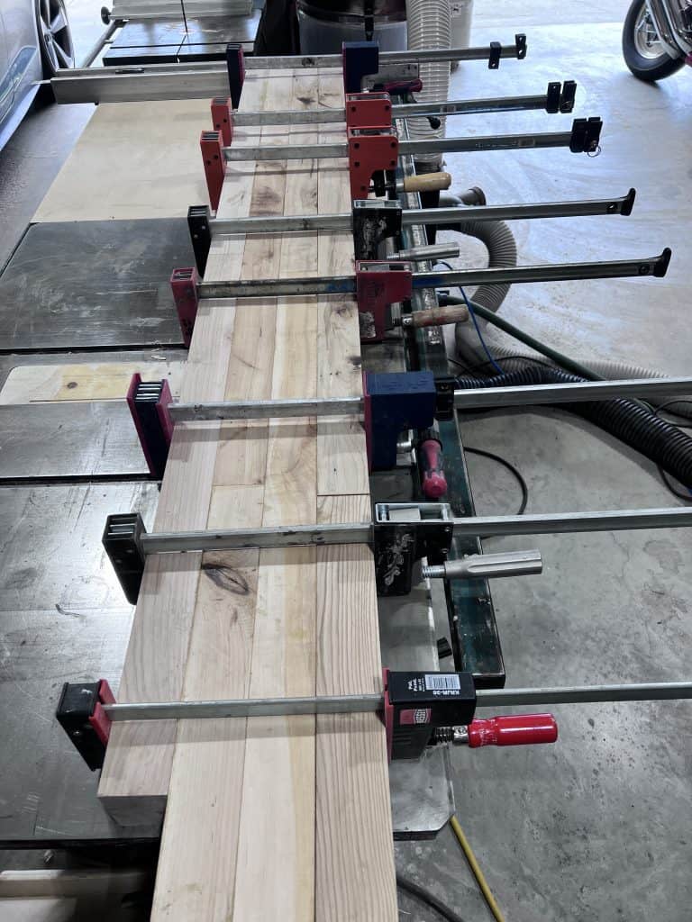 The top glued up and clamped with parallel clamps along its whole length.